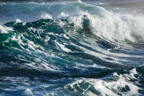 istock Big stormy ocean wave. Blue water background 673237352