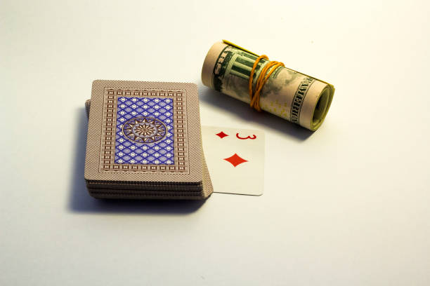 A stack of cards with dollars on top