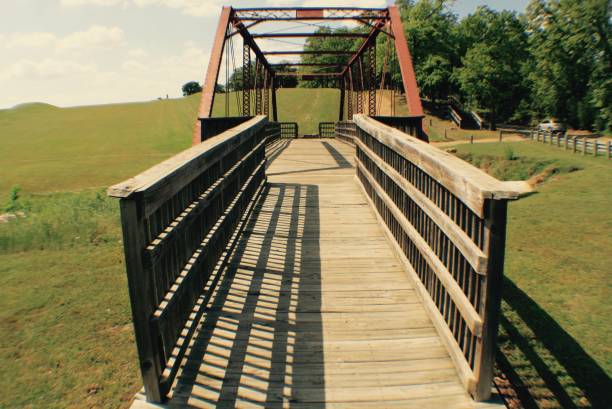istock Overcast Wooden Bridge in the Park 673247534