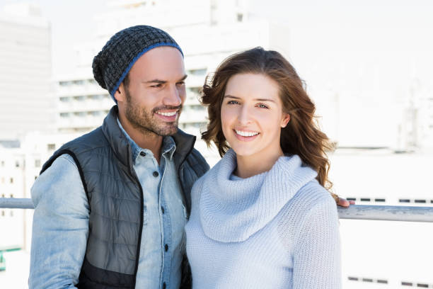 istock Happy young couple standing together 673250376