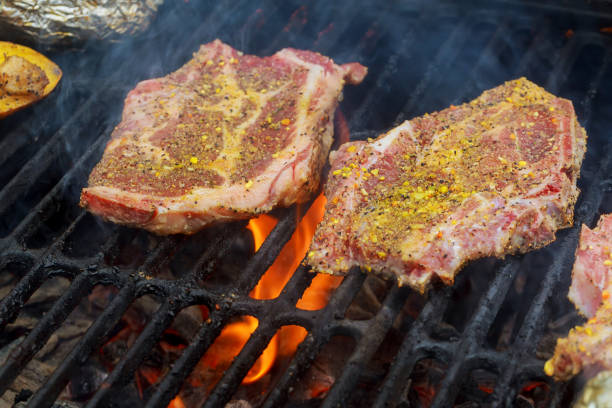 istock Grilled pork steaks on the grill 673256192