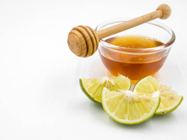 istock Honey and lemon on white background. 673262738