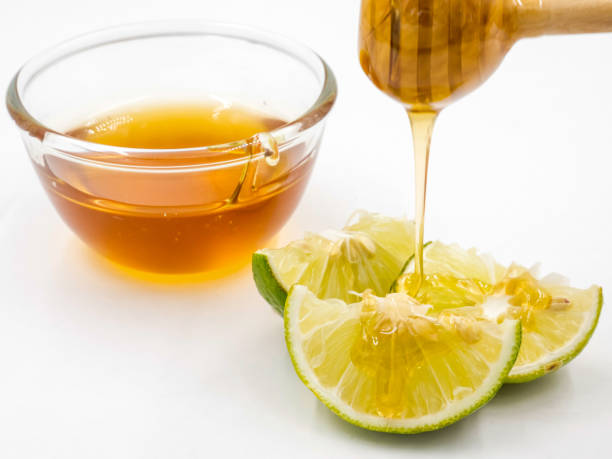 istock Honey and lemon on white background. 673262740
