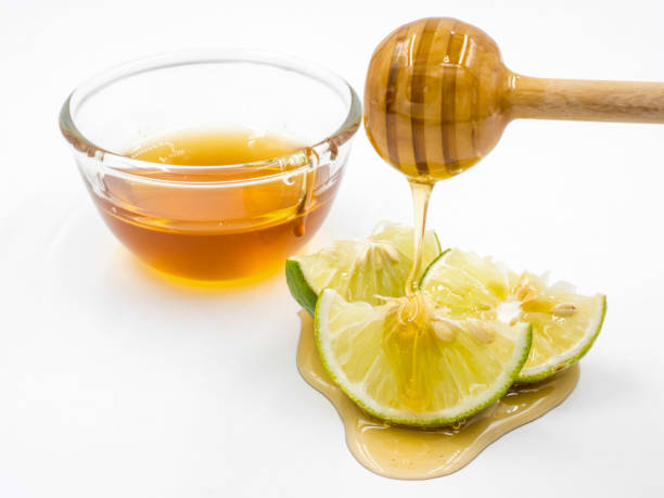 istock Honey and lemon on white background. 673262760