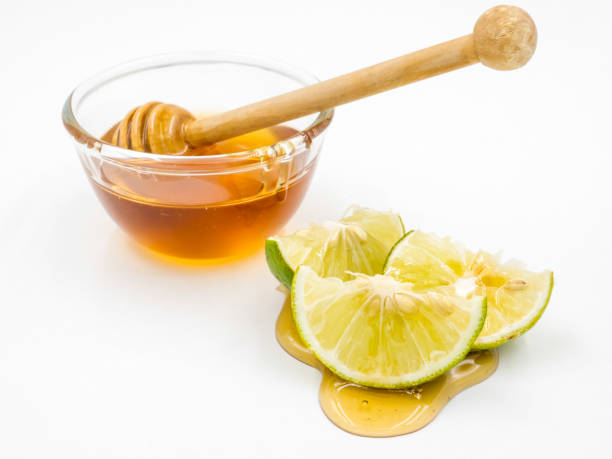 istock Honey and lemon on white background. 673262764
