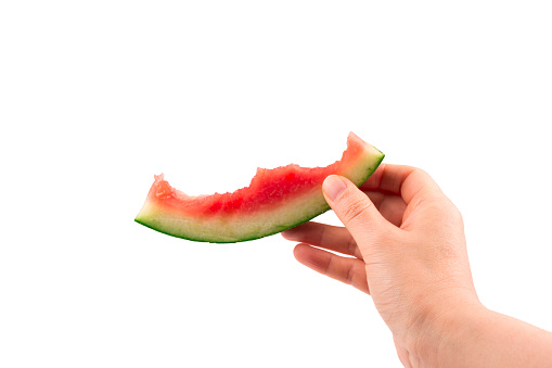 Watermelon in the hand over white background