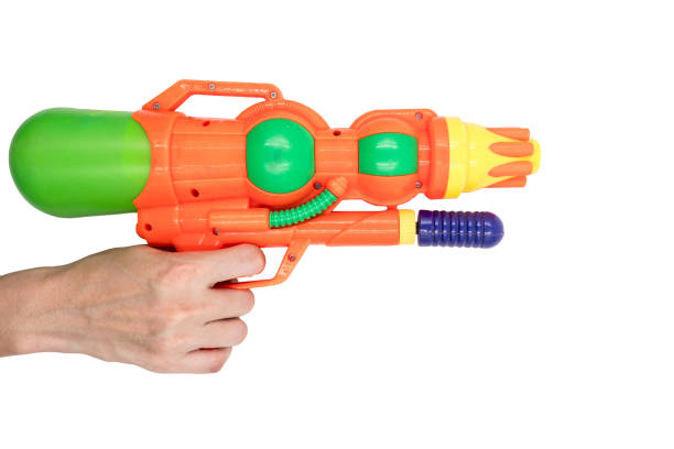 istock Hands holding gun water toy on white background. 673263104