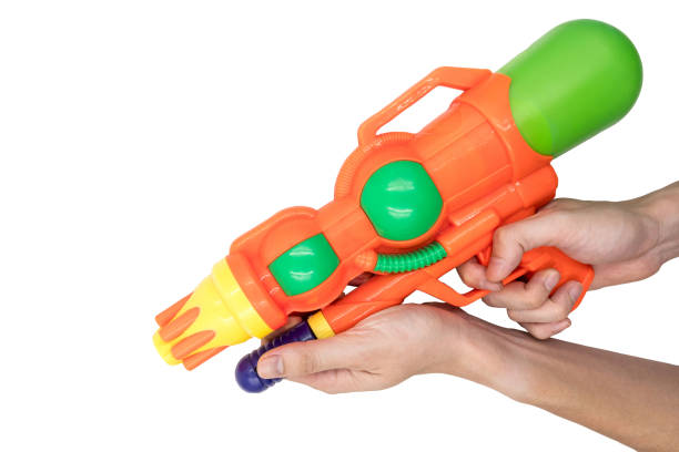 istock Hands holding gun water toy on white background. 673263226