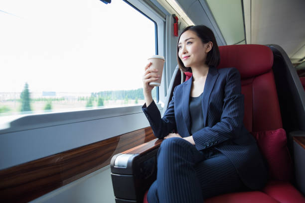 shot of beautiful business woman sitting inside high-speed train,Shanghai,China. stock photo