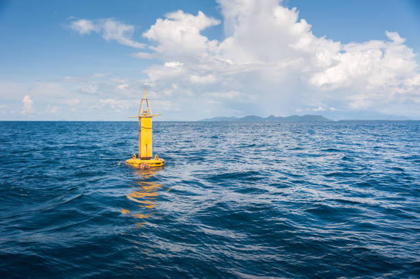 Yellow Sea Buoy, in Andaman Sea, Thailand Yellow Sea Buoy, in Andaman Sea, Thailand buoy stock pictures, royalty-free photos & images