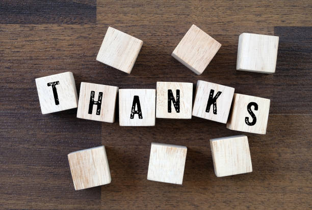 istock Thanks word on wooden cubes background 673273218