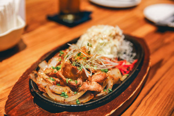 istock Beef teriyaki on wooden hot plate 673279446