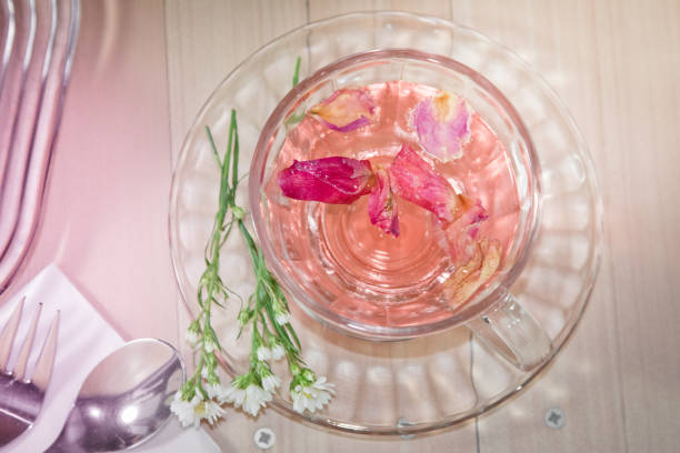 istock Rose tea with honey and milk on wooden table 673282350