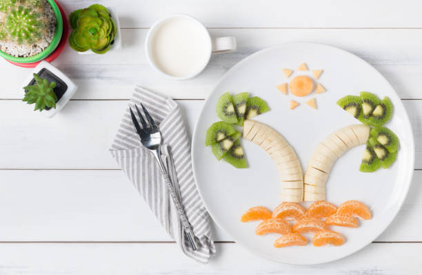istock banana kiwi orange and melon on dish 673288720