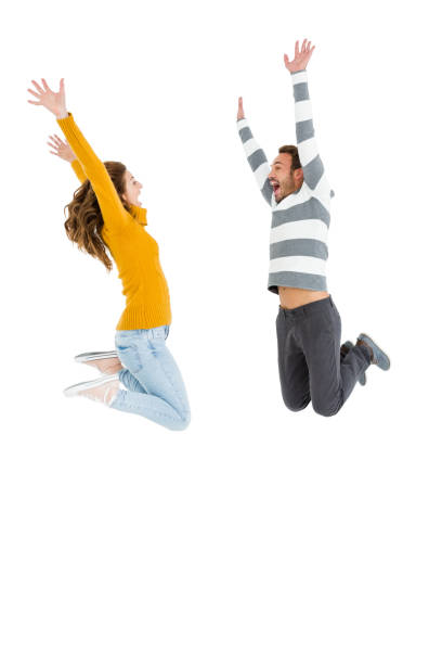 istock Happy couple jumping in excited 673289914