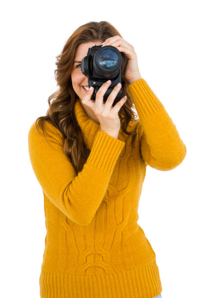 istock Woman photographing with camera 673294722
