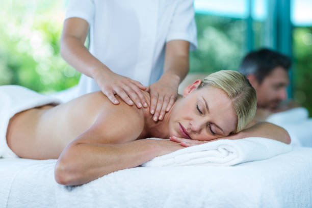 istock Woman receiving back massage from masseur 673294814