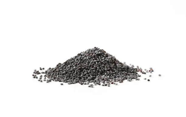 Heap of whole poppy seeds on white background