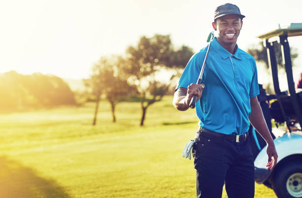 Going golfing today and it's gonna be good Shot of a young man playing golf golfer stock pictures, royalty-free photos & images