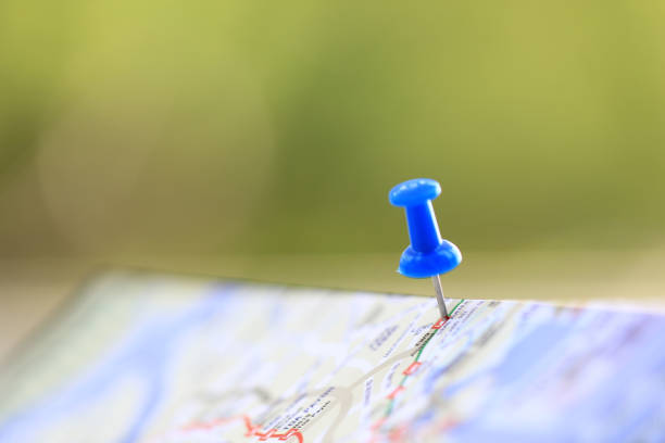 istock Travel concept with blue pushpin on a tourist map 673305038