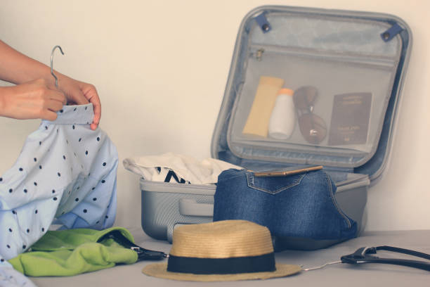istock Open travel bag with clothes and accessory, travel and vacations concept 673305086