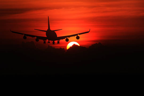 istock Airplane with beautiful sky at sunset on background 673314516