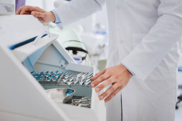 istock Close up of medical worker taking instrument 673326322