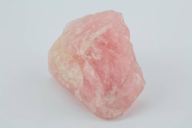 istock Rose quartz stone isolated on white background 673326918
