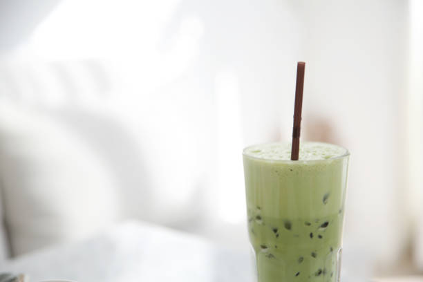 istock Iced green tea latte in white coffeeshop 673326986