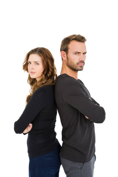 Depressed couple standing back to back