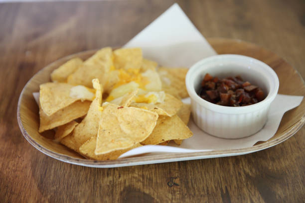 istock Cheese nachos with tomato sauce 673331232