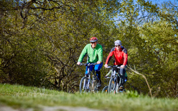 istock Walking a bike through the forest in the spring. 673336308
