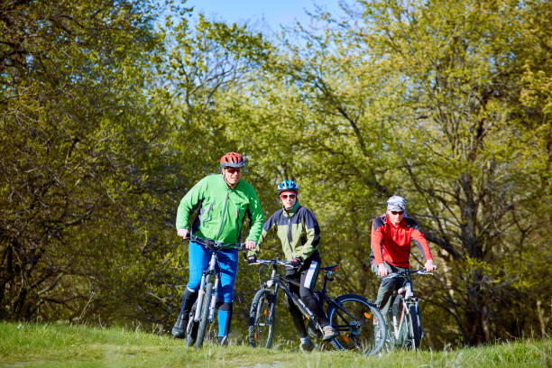 istock Walking a bike through the forest in the spring. 673336312