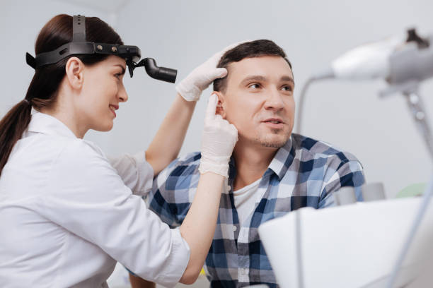 istock Portrait of attentive otolaryngologist while working 673337640