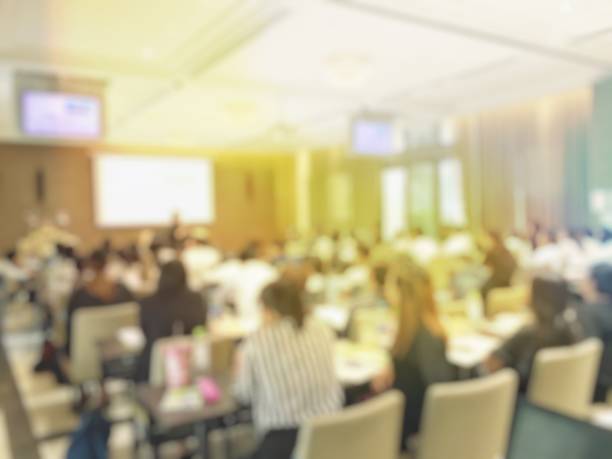 istock Blurred image of education people  sitting in conference room 673337988