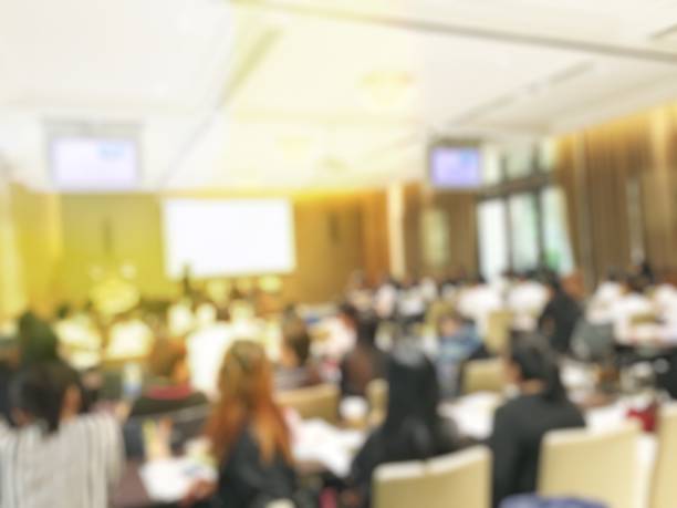 istock Blurred image of education people  sitting in conference room 673338064