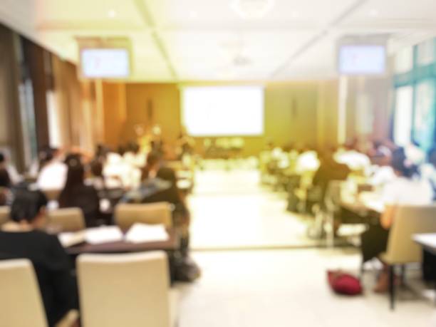 istock Blurred image of education people  sitting in conference room 673338166