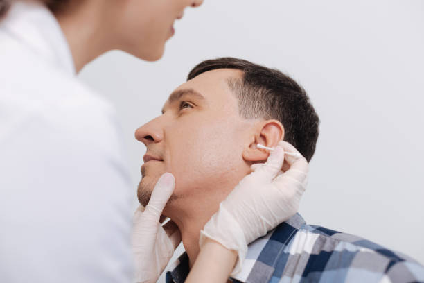 istock Close up of male head while being at checkup 673343360