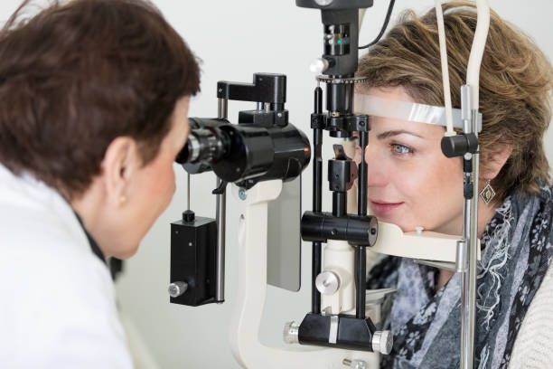 istock Female patient having eye examination 673344260