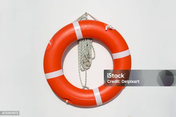 Life Belt Hanging On White Wall At The Pool Stock Photo - Download Image Now - Life Belt, Life Jacket, Nautical Vessel