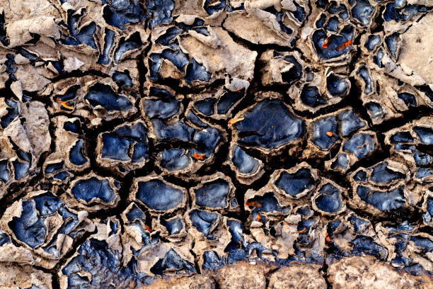 istock cracked earth from oil spills 673347438