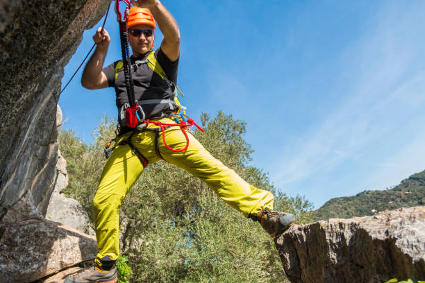 istock Young male climbing a via ferrata 673350510
