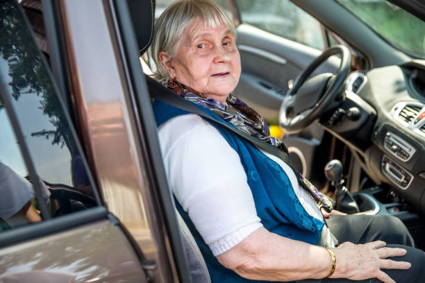 istock Senior Lady Sitting in Car 673354186