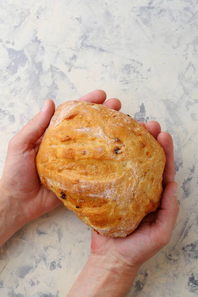 istock Artisan bread in men's hands, food cocept 673357168