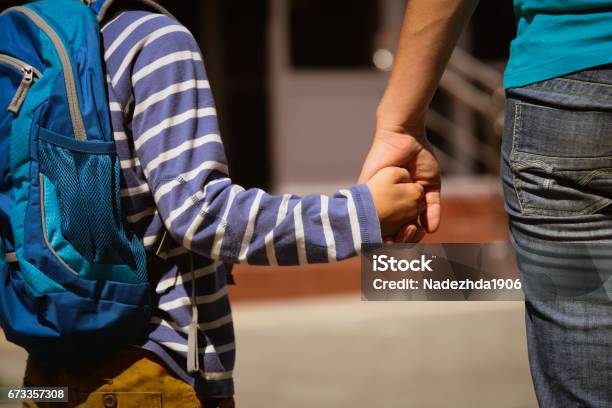 Going To School Mother Holding Hand Of Son Stock Photo - Download Image Now - Mother, Child, Son