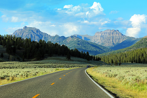 Lamar Valley Road surrounded by beautiful mountains at the North East Entrance of Yellowstone National Park