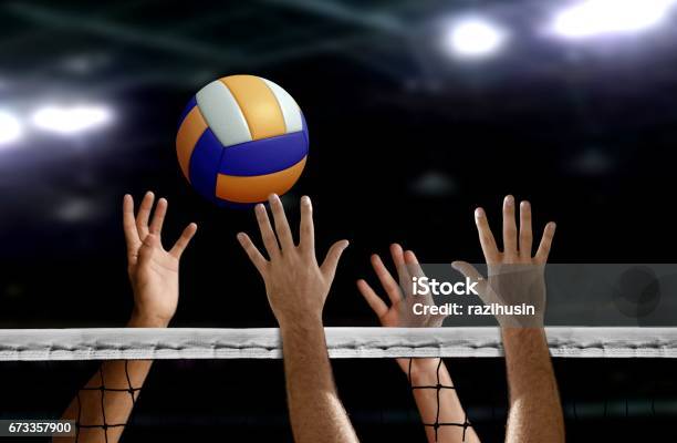 Volleyball Spike Hand Block Over The Net Stock Photo - Download Image Now - Volleyball - Sport, Indoor Volleyball, Sports Ball