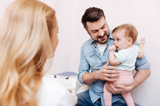 istock Attentive baby putting his thumb into mouth 673361012