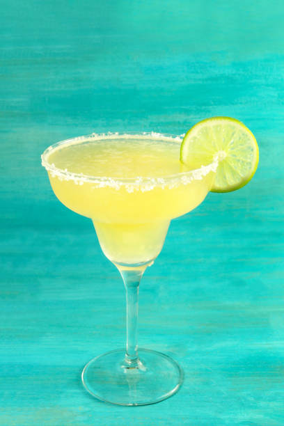 istock Lemon Margarita cocktails on vibrant turquoise with copyspace 673361122