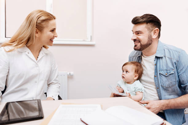 istock Positive delighted doctor looking at her patient 673363966